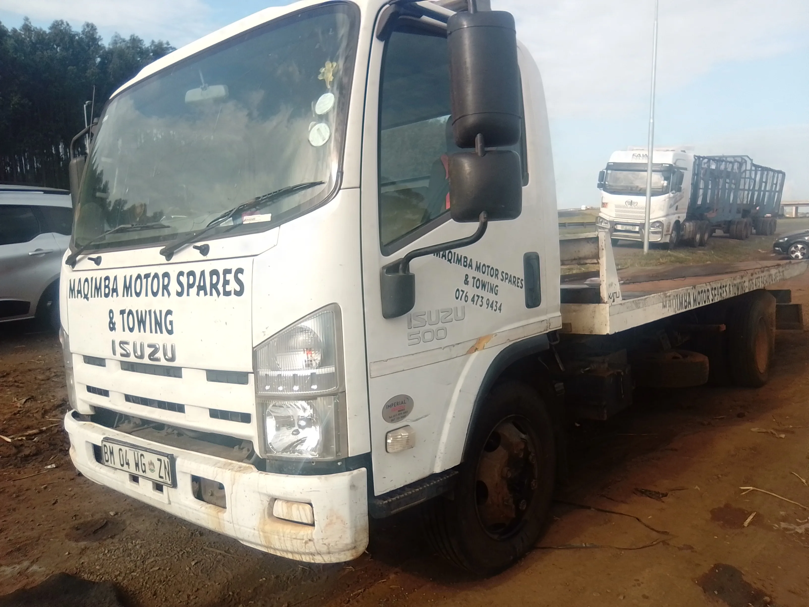 Maqimba Motor Spares & Towing — Isuzu 500 flatbed tow truck
