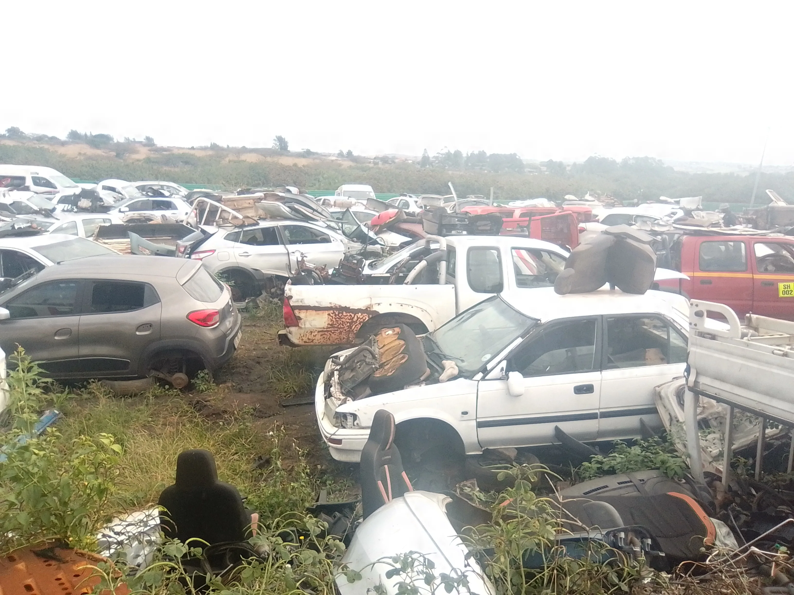 Maqimba Used Spares — rows of stripped vehicles in yard